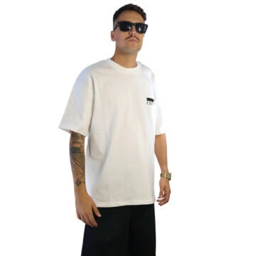 Man wearing white Calligraffiti T-Shirt and sunglasses, posing confidently.