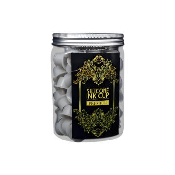 Gray silicone ink cups for tattooing in a clear jar.