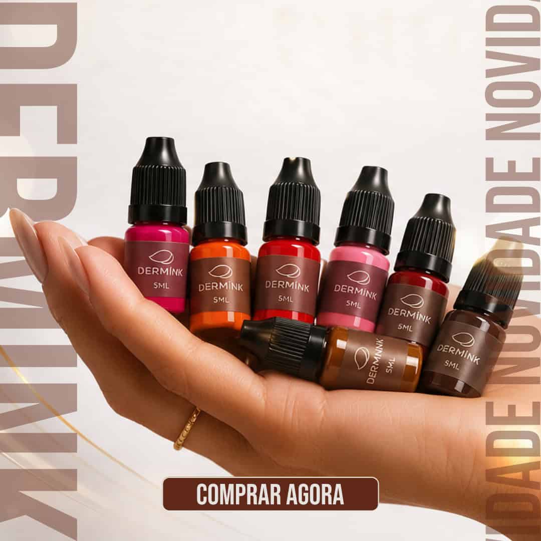 Assorted tattoo ink bottles held in hand for tattoo supplies.